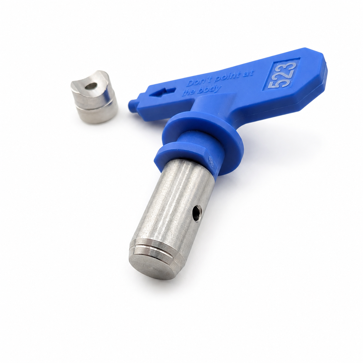 Reversible airless paint sprayer nozzle tips